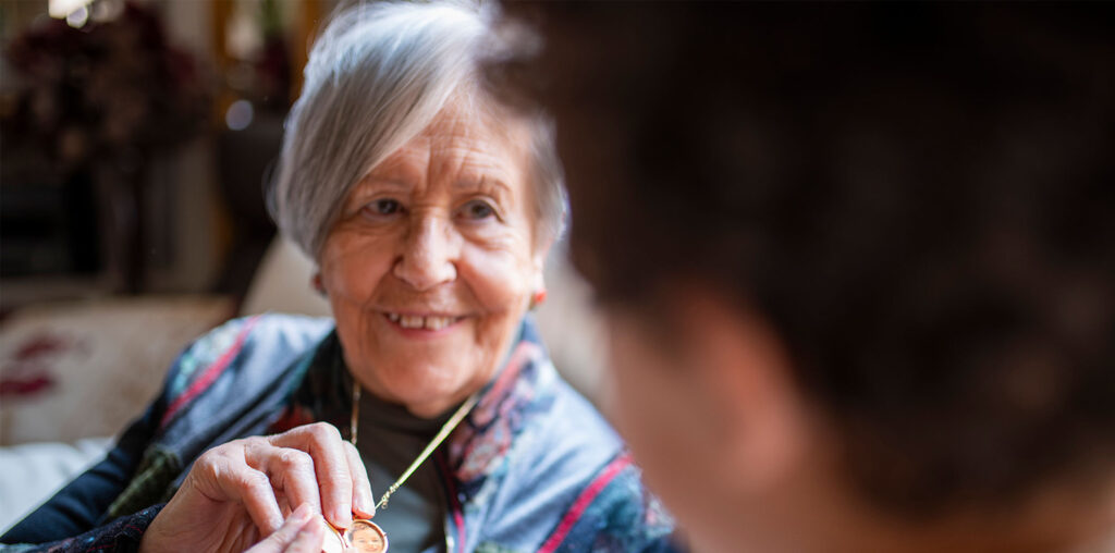 carer helping with medication at home