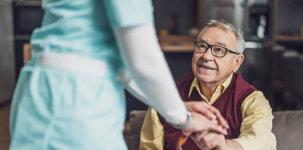 carer providing palliative support at home
